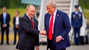 U.S. President Donald Trump (R) greets Russian President Vladimir Putin as he arrives at Joint Base Elmendorf-Richardson on August 15, 2025 in Anchorage, Alaska