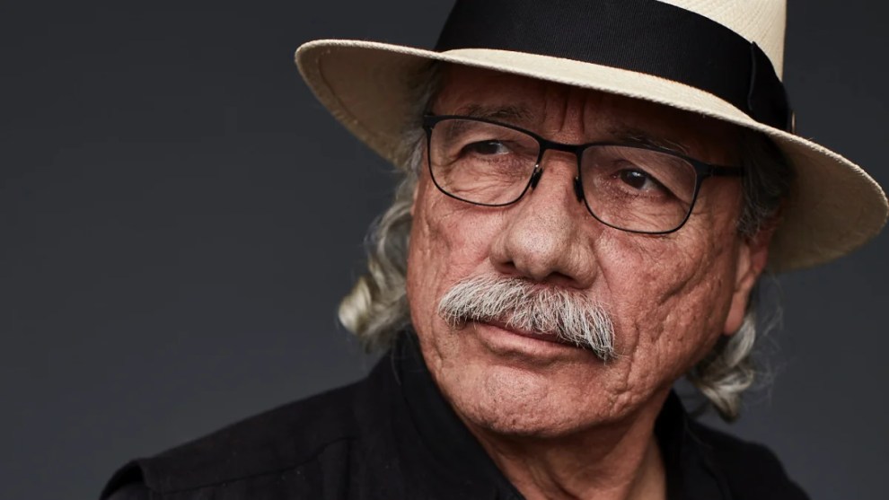 Edward James Olmos poses while wearing a hat