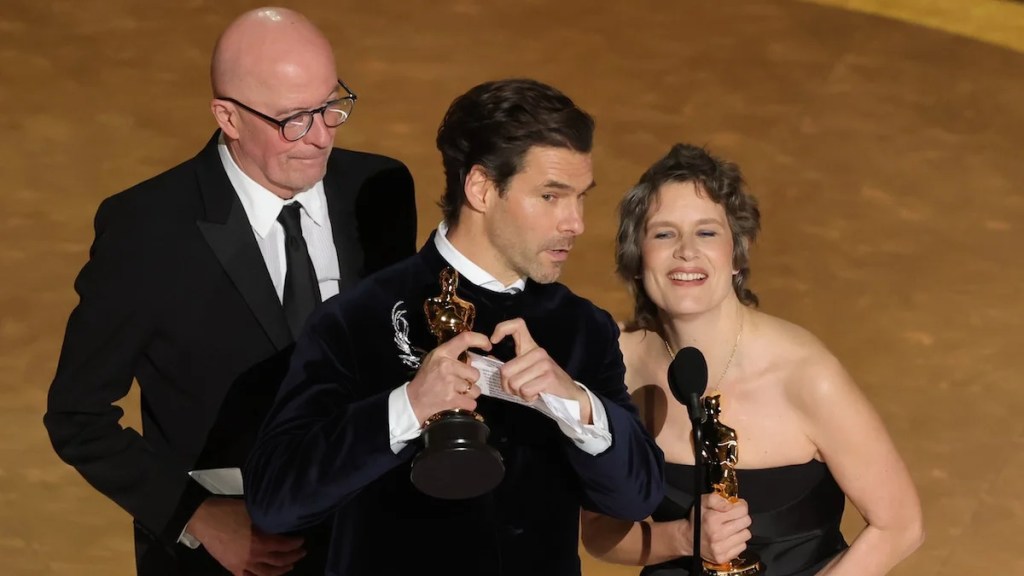 Jacques Audiard, Clément Ducol, and Camille Dalmais (Credit: Kevin Winter/Getty Images)
