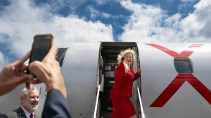 Orange County Supervisor Katrina Foley checks out a JSX jet during the grand opening and ribbon cutting for the airline's new location at John Wayne Airport in April 2025. (Source: Mindy Schauer/Getty Images)