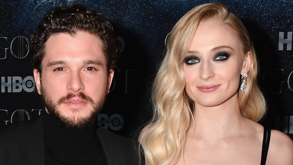 Kit Harington (Left) and Sophie Turner (Right) pose at a "Game of Thrones" event
