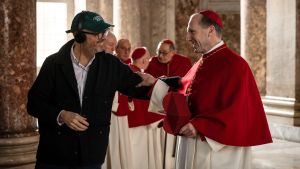 Director Edward Berger and Ralph Fiennes on the Rome set of "Conclave." (Philippe Antonello/Focus Features)